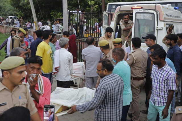 Officials in the rescue process of victims who died in the India religious event